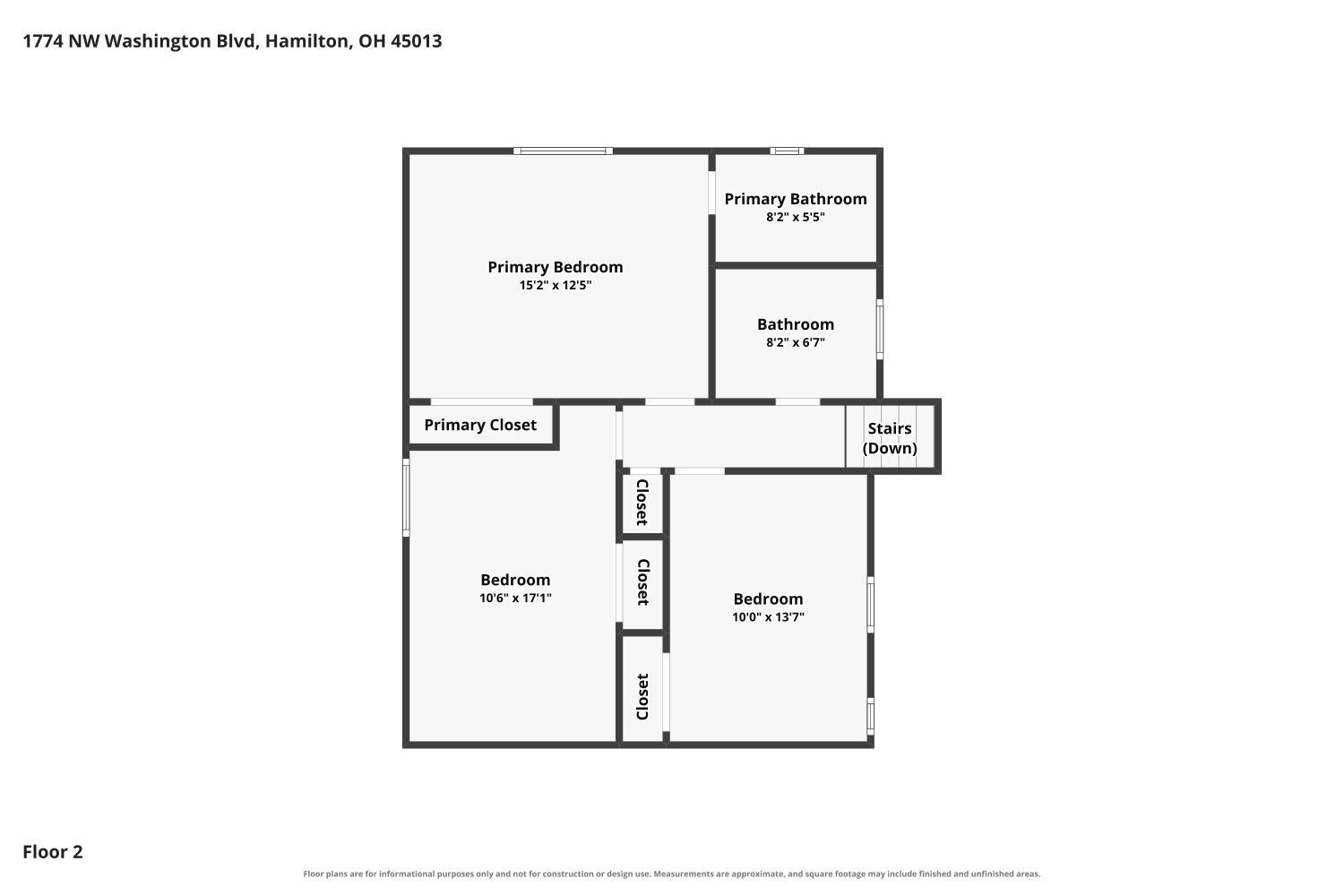 Second-floor plan showing three bedrooms, two bathrooms, closets, and stairs.