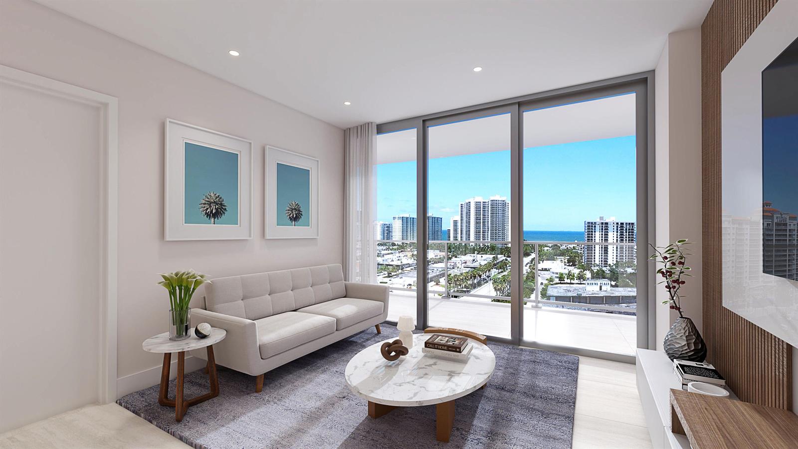 Living room with floor-to-ceiling windows overlooking city buildings and the ocean.
