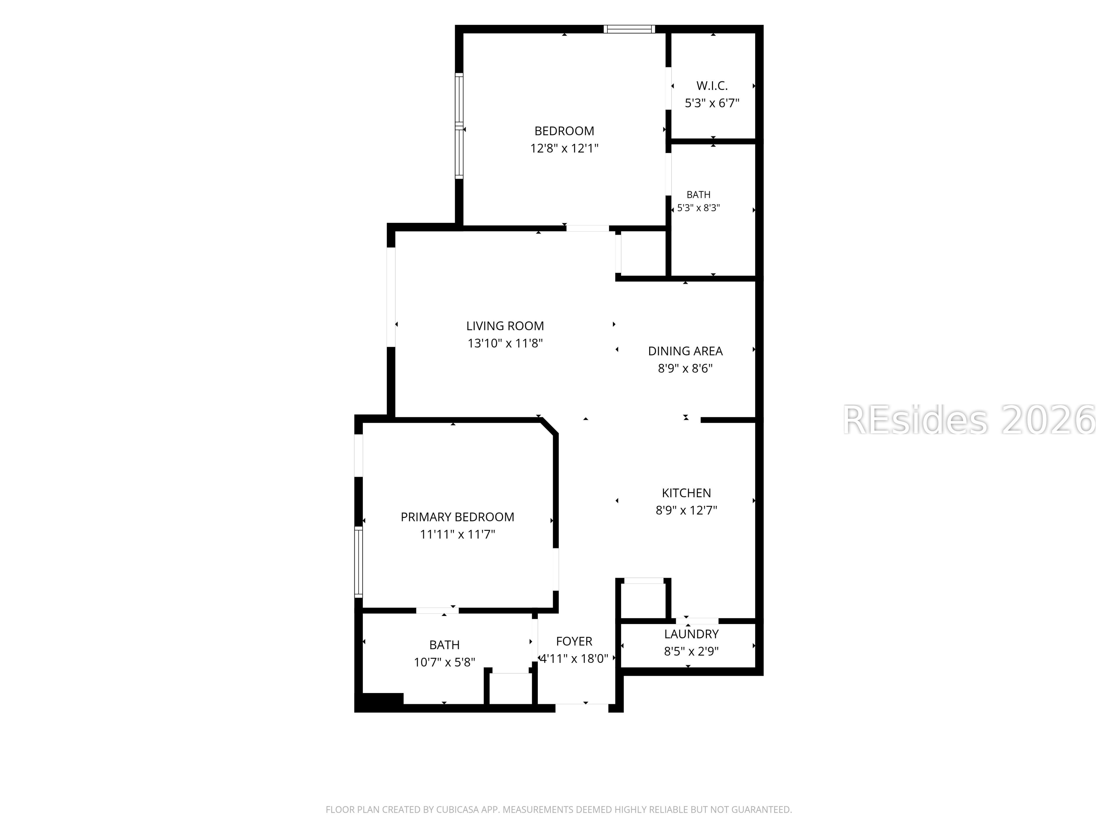 Floor plan showing two bedrooms, two bathrooms, living and dining areas, kitchen, foyer, and laundry.