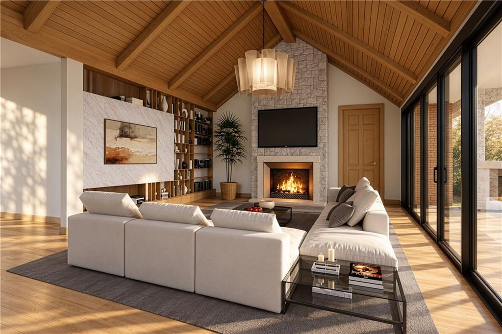 Living room with a vaulted wood ceiling, stone fireplace, and floor-to-ceiling glass doors.