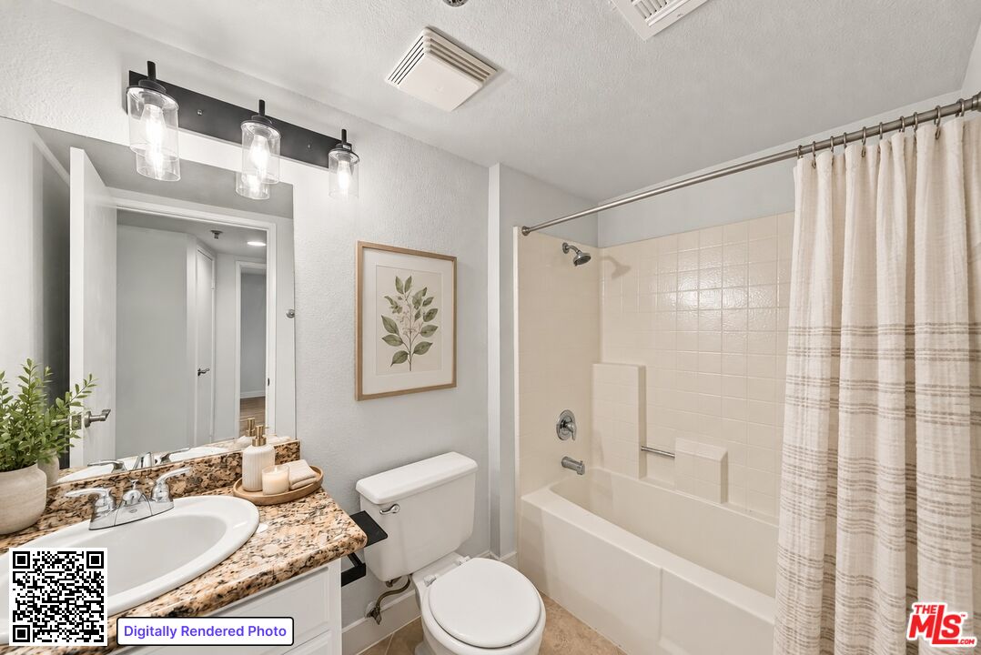 Bathroom with a patterned vanity countertop and a white tub behind a striped shower curtain.