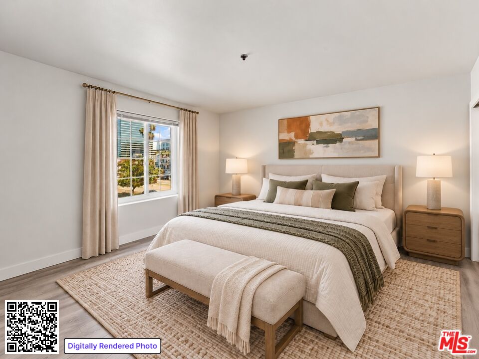 Staged bedroom with a white upholstered bed, matching nightstands, and a curtained window.