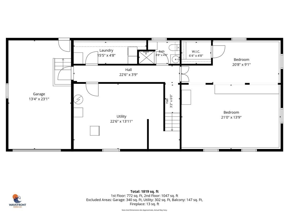 Floor plan showing a garage, utility room, laundry, bath, walk-in closet, and two bedrooms.