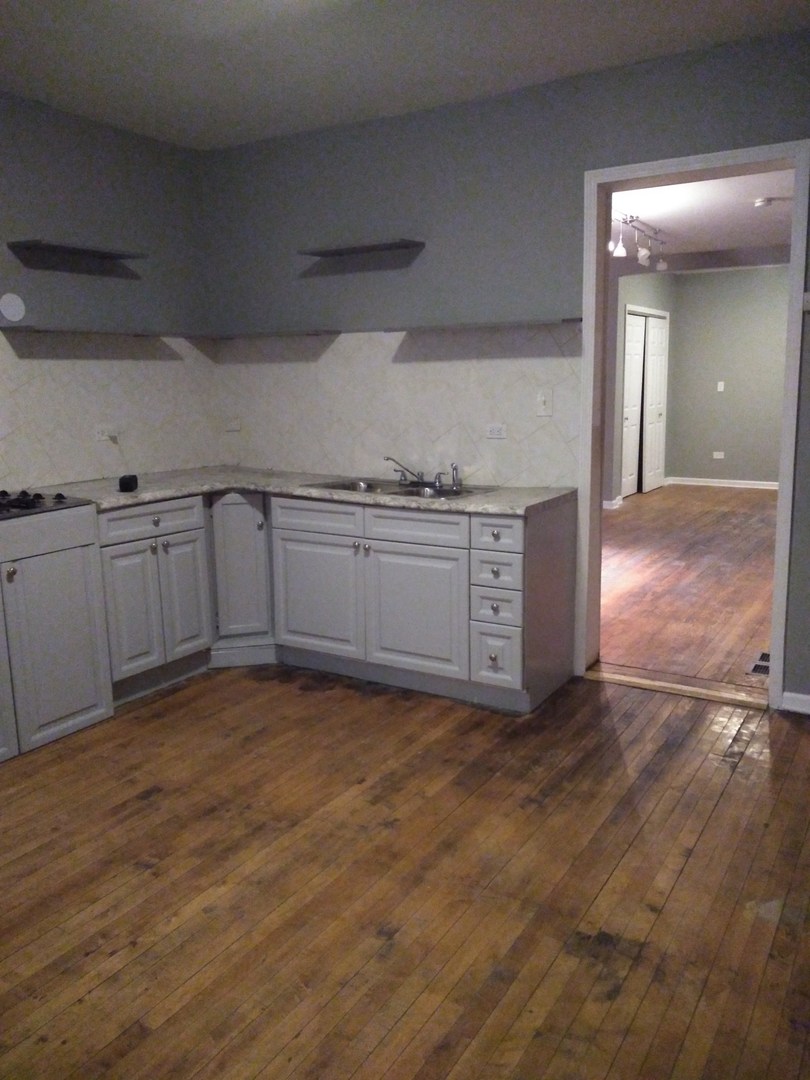 6619 S Peoria Street Unit: 1