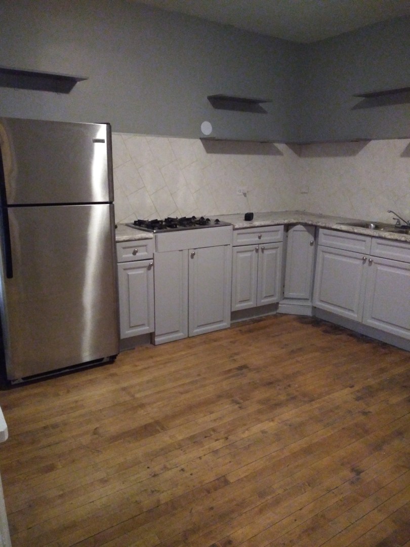 6619 S Peoria Street Unit: 1