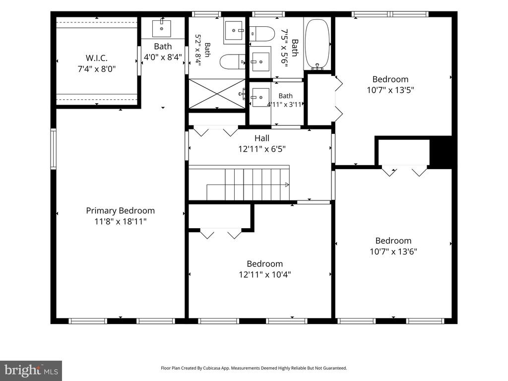 Second-floor plan with a primary bedroom, three bedrooms, bathrooms, walk-in closet, and central hall.