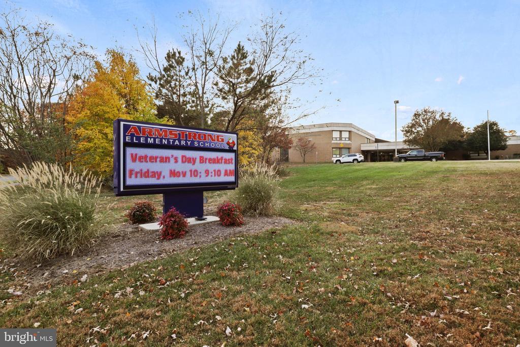 Armstrong Elementary School, with a sign announcing a Veterans Day breakfast.