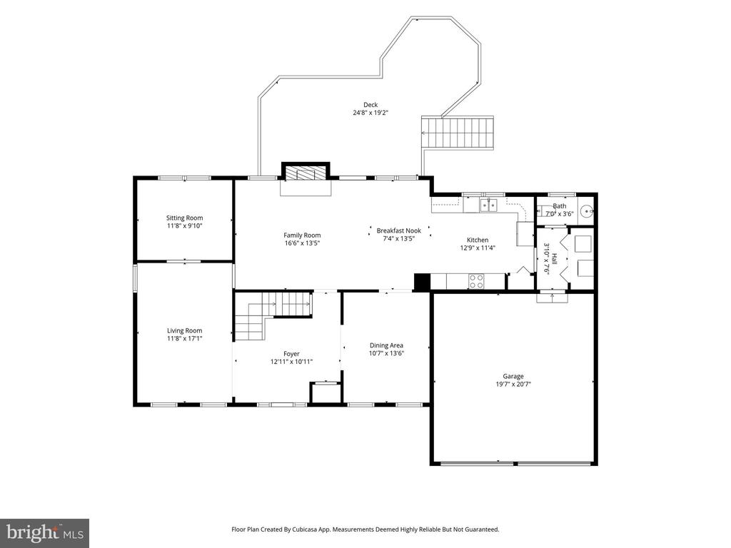 Floor plan showing the home’s rooms, garage, and deck with labeled dimensions.