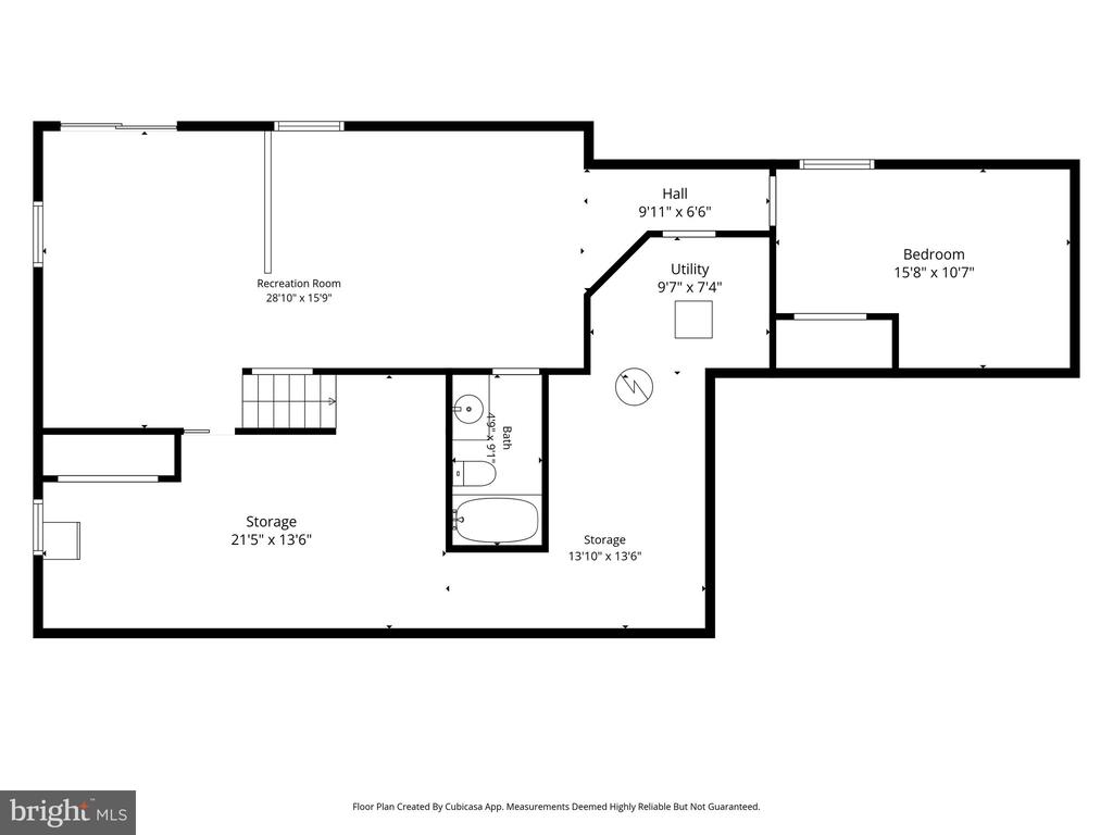 Floor plan showing a recreation room, bedroom, utility room, bathroom, two storage areas, and stairs.