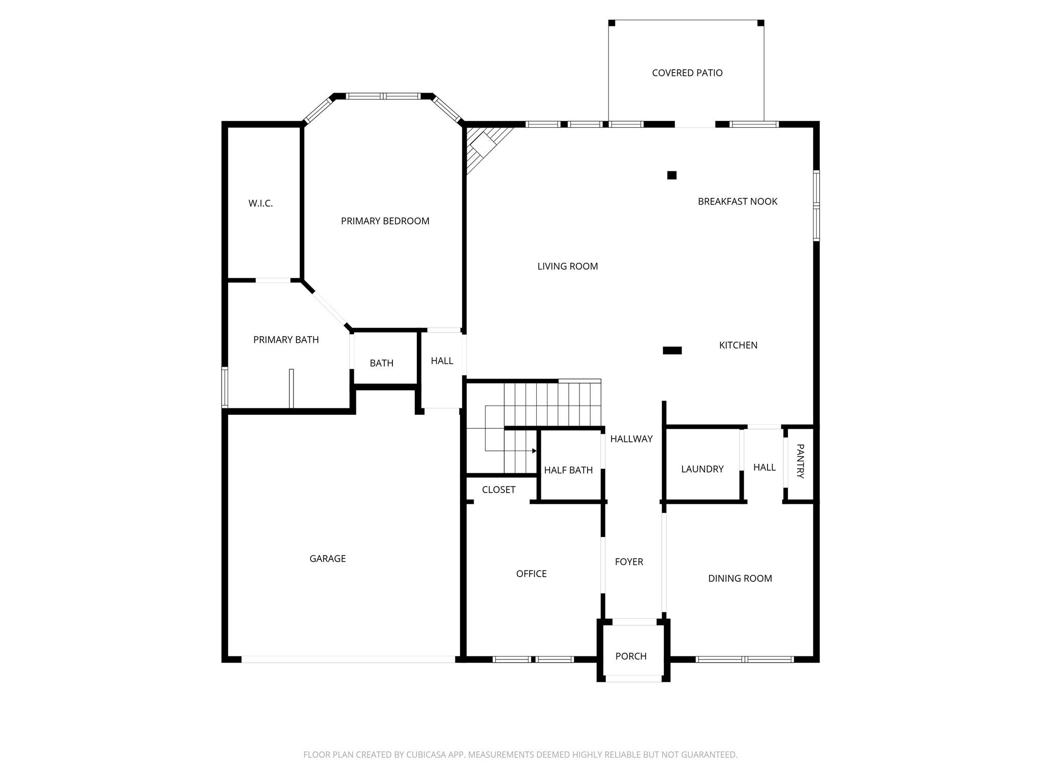 Floor plan with a primary suite, open living and kitchen area, office, dining room, garage, and covered patio.