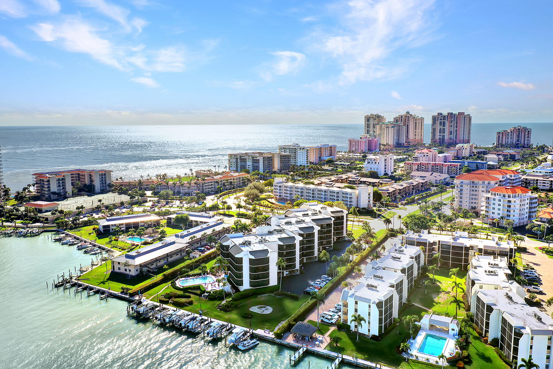 Waterfront condos on Marco Island, with boat docks in the foreground and high-rises along the Gulf coast.