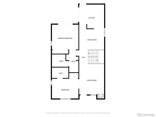 Floor plan showing a kitchen, dining area, living room, two bedrooms, three baths, and a staircase.