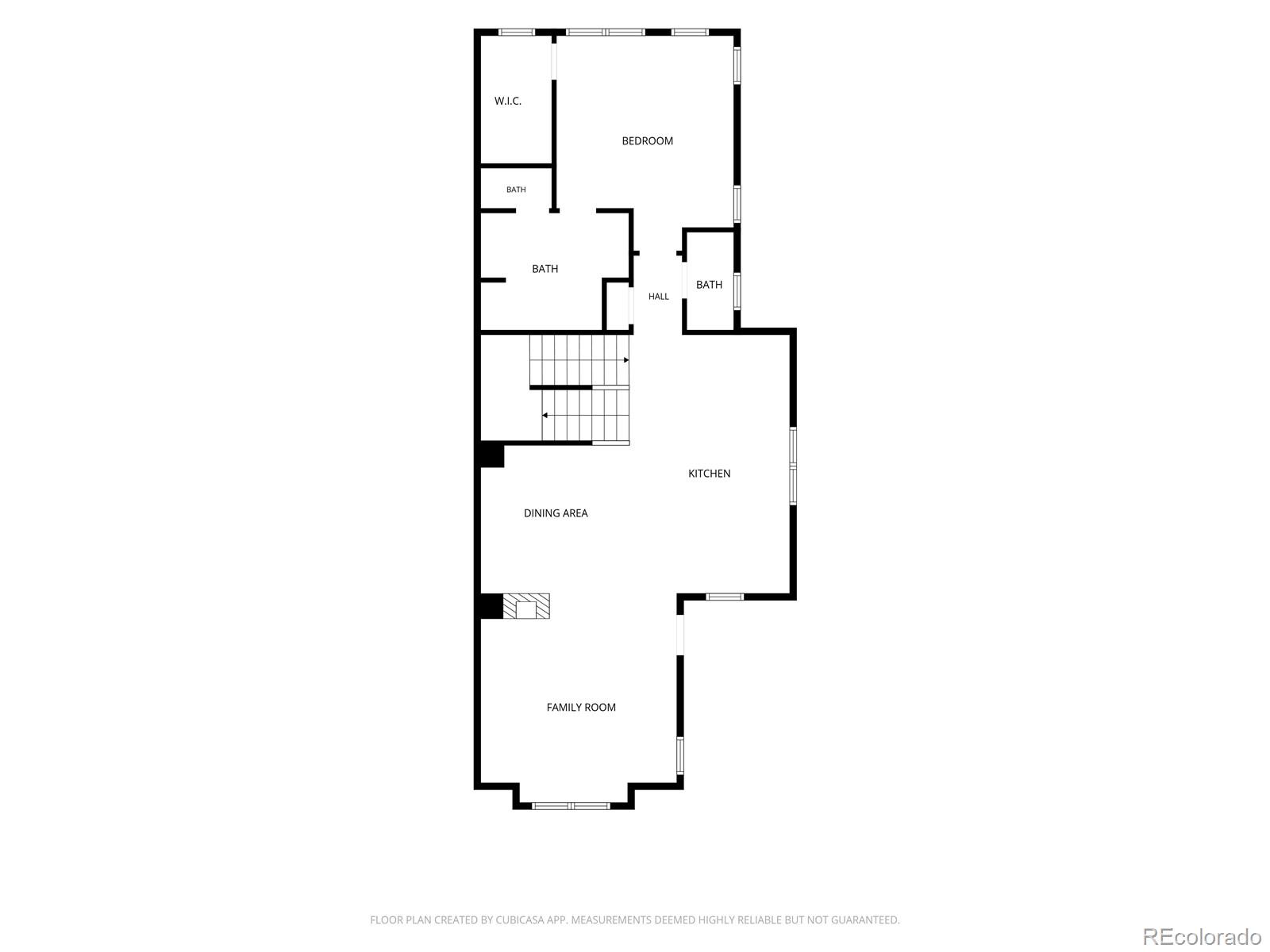 Floor plan showing a bedroom, three bathrooms, kitchen, dining area, and family room.