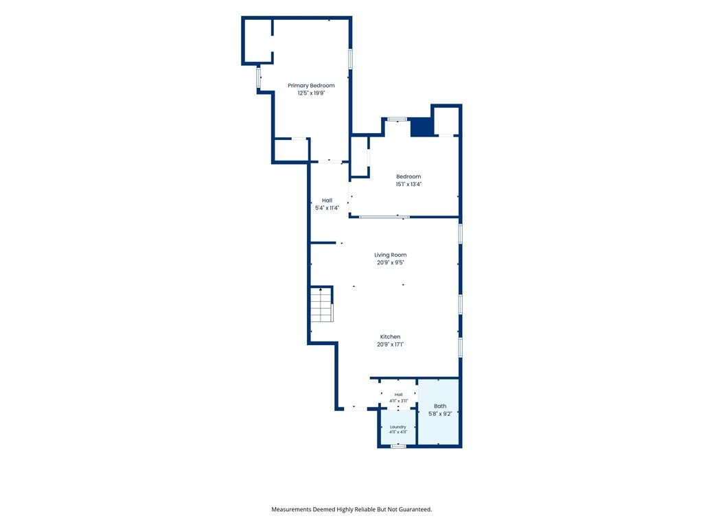 Floor plan showing two bedrooms, a living room, kitchen, laundry room, and bath.