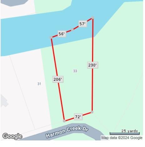 Map of parcel 33 on Harmon Creek Drive with red boundary lines and measurements.