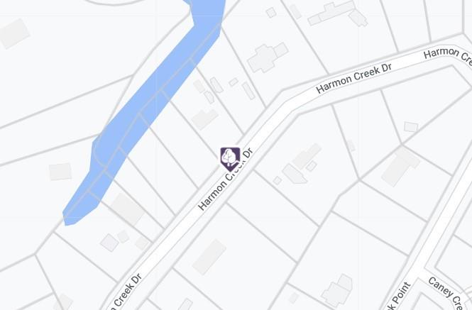 Map marking a location on Harmon Creek Drive beside a blue creek.