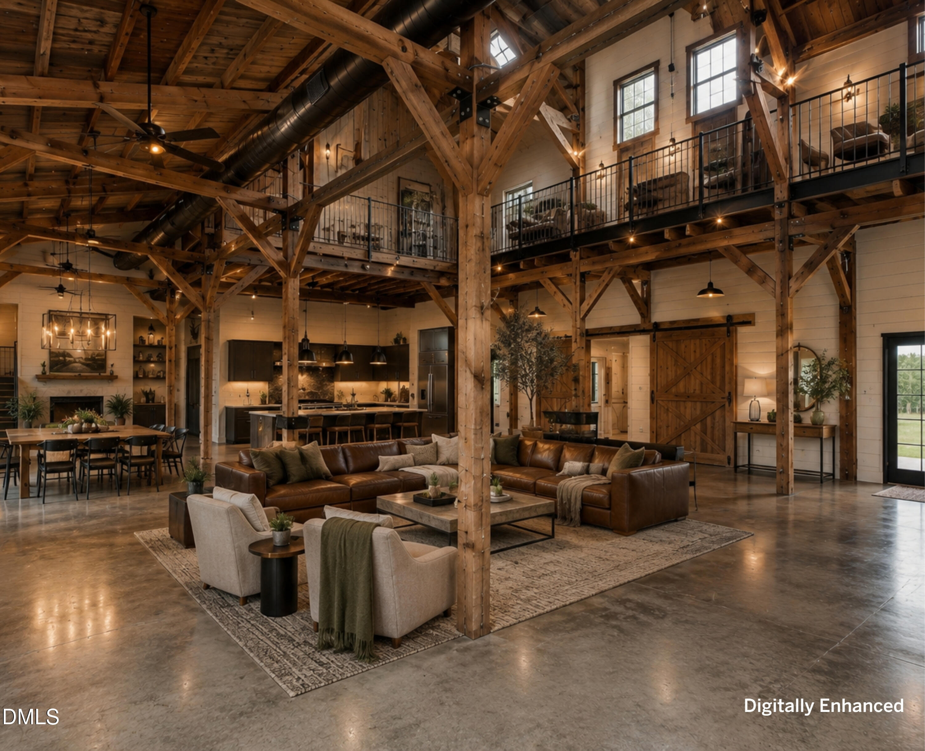 Vaulted great room with exposed timber beams, an upper-level loft, leather seating, dining area, and kitchen.