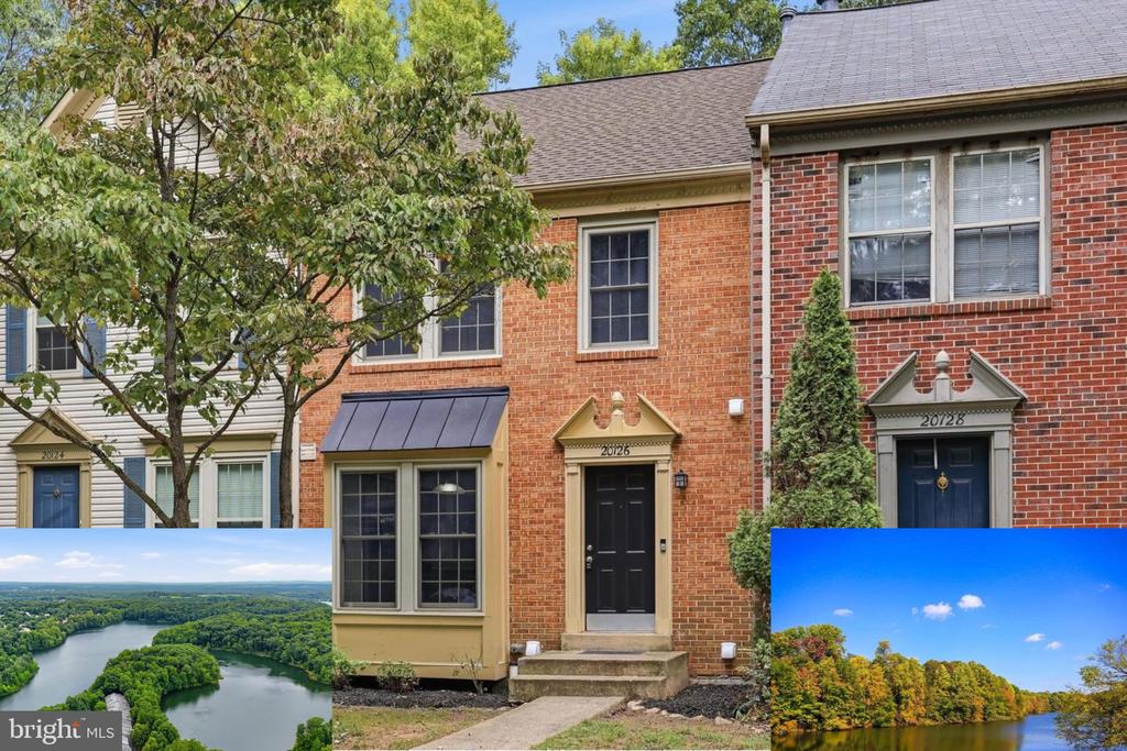 Brick townhouse exterior with a black front door, alongside aerial and wooded water views.
