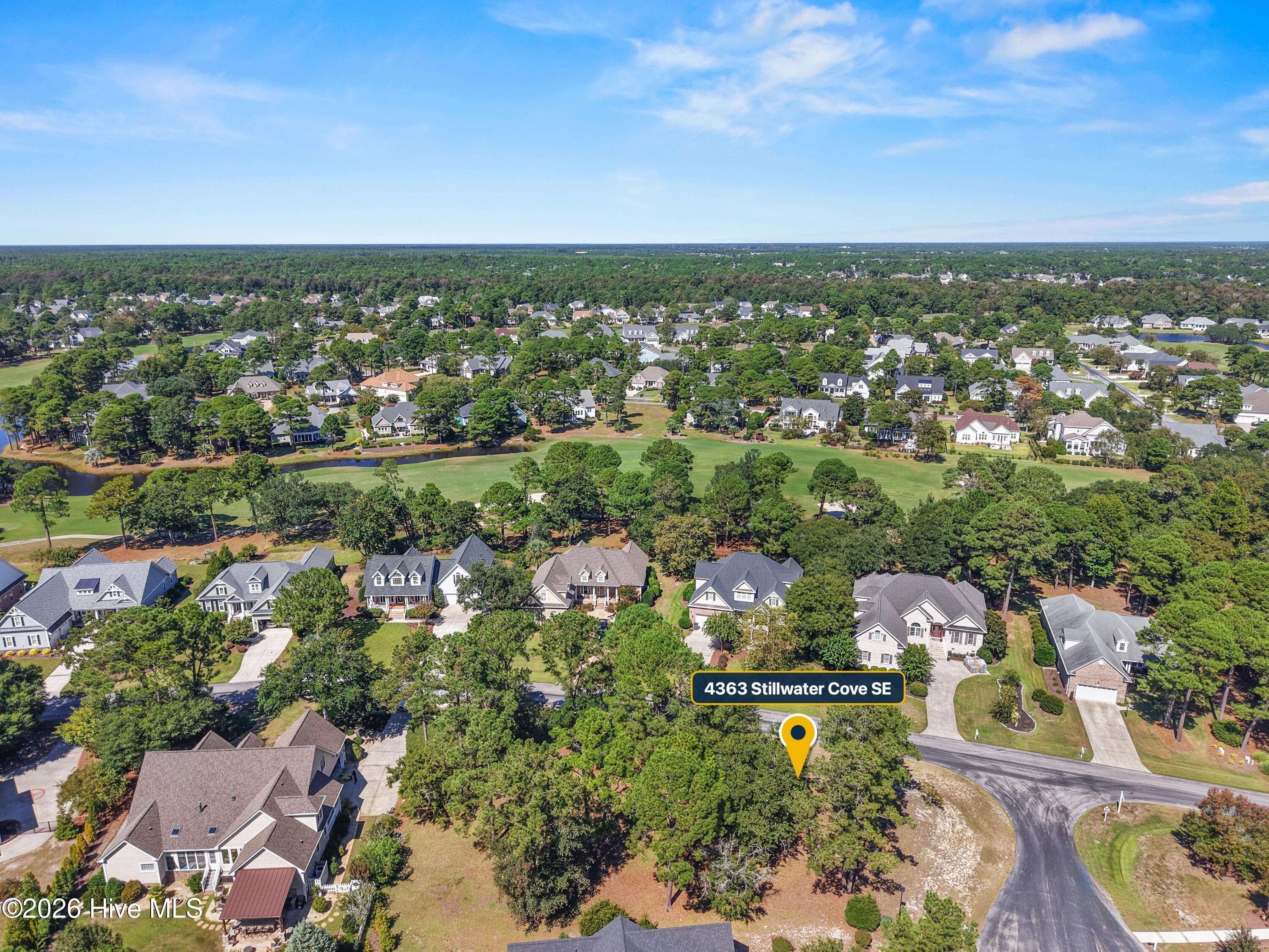 Aerial neighborhood view with homes and trees; a yellow marker labels 4363 Stillwater Cove SE.