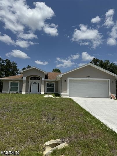 Single-story house with an arched entry, attached two-car garage, and broad front lawn.