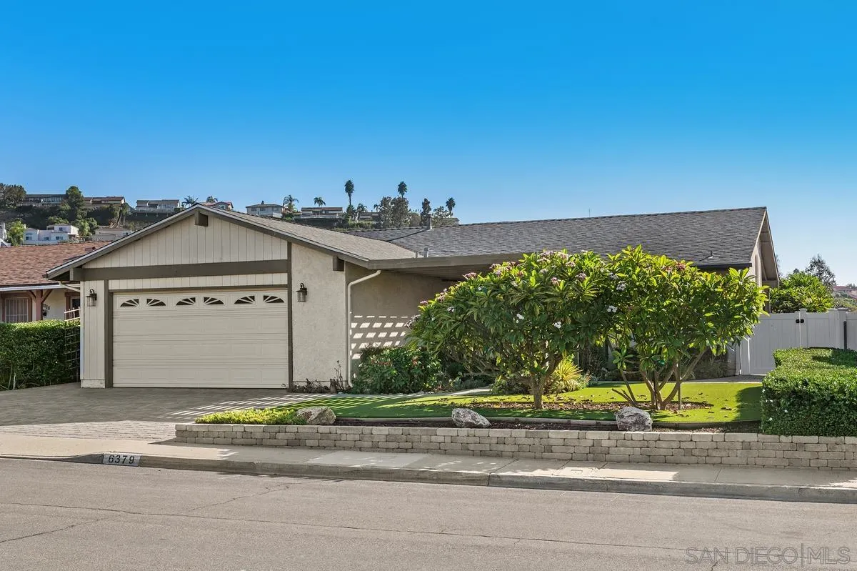 Single-story house with a two-car garage, landscaped front yard, and curb number 6379.