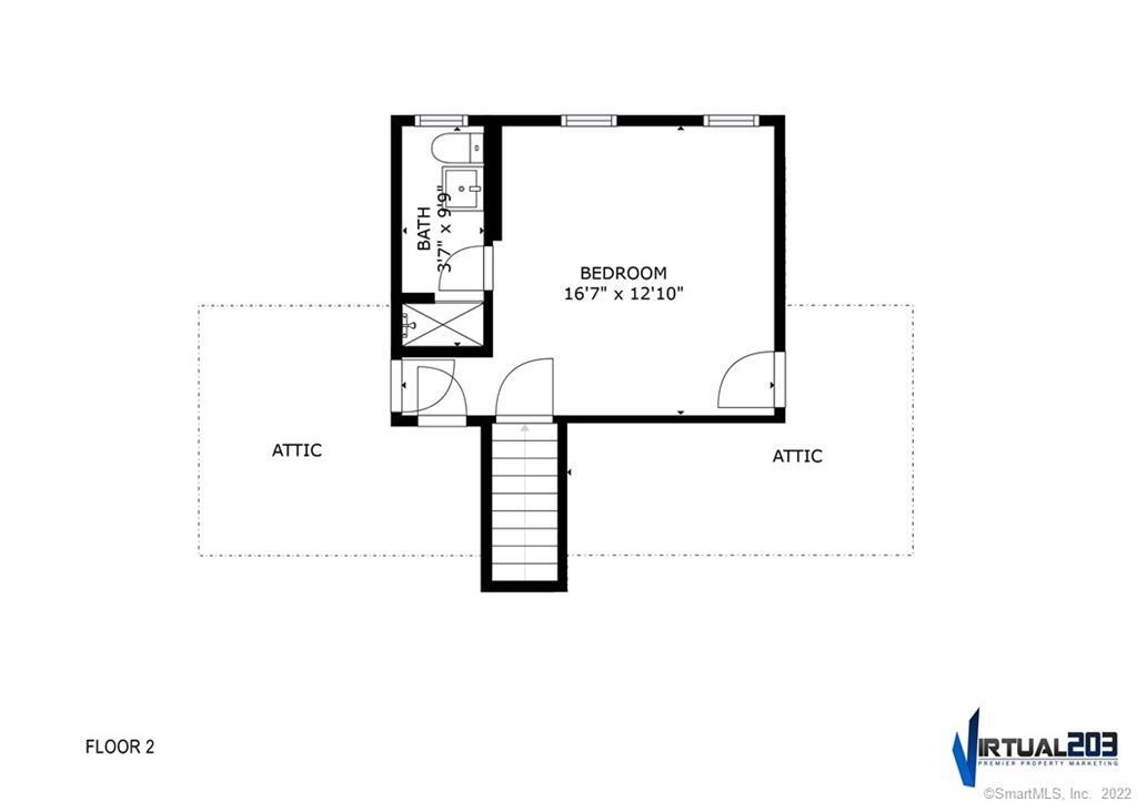 Second-floor plan with a bedroom, bathroom, two attic areas, and a central staircase.
