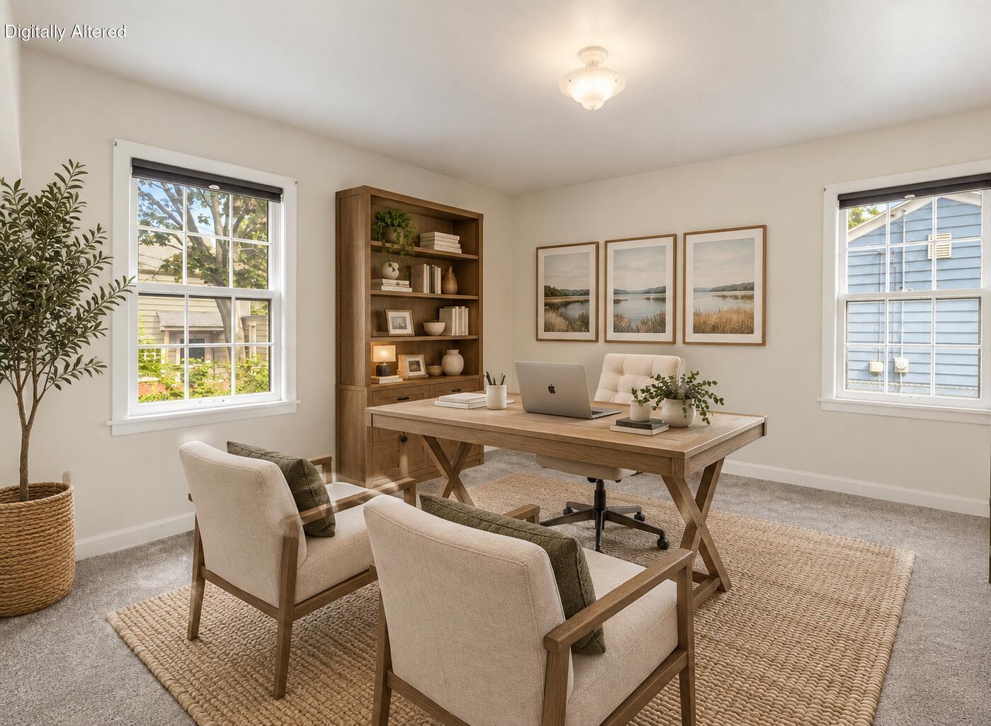 Staged home office with a wooden desk, built-in bookcase, and two chairs between windows.