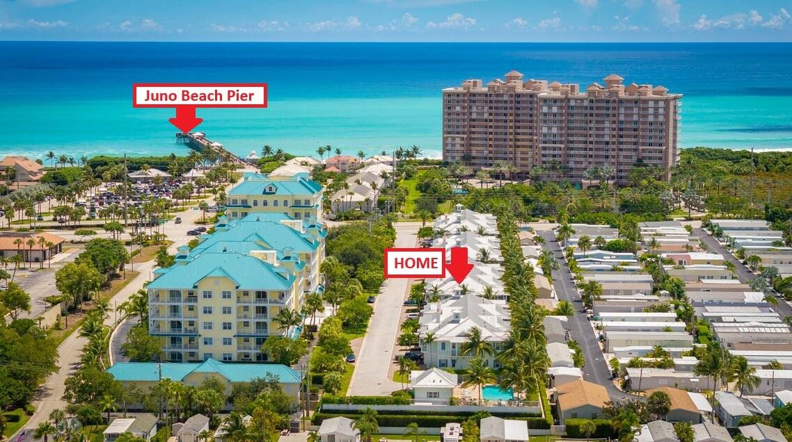 Aerial view of coastal homes near Juno Beach Pier, with the property marked.