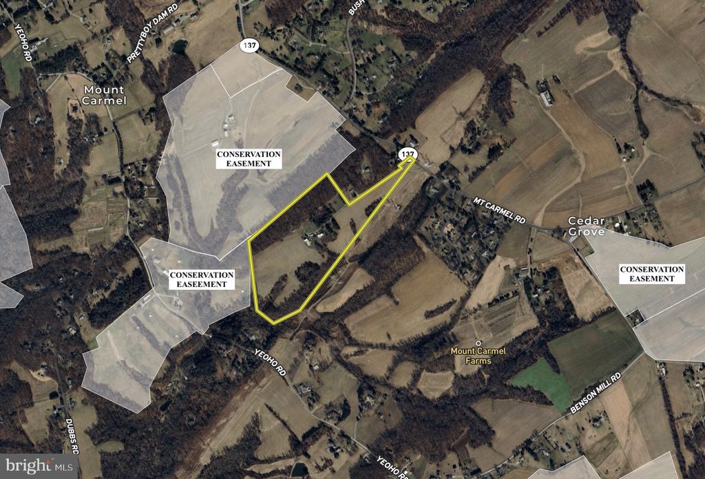 Aerial map showing the Mount Carmel Road property outlined in yellow among fields, woods, and conservation easements.