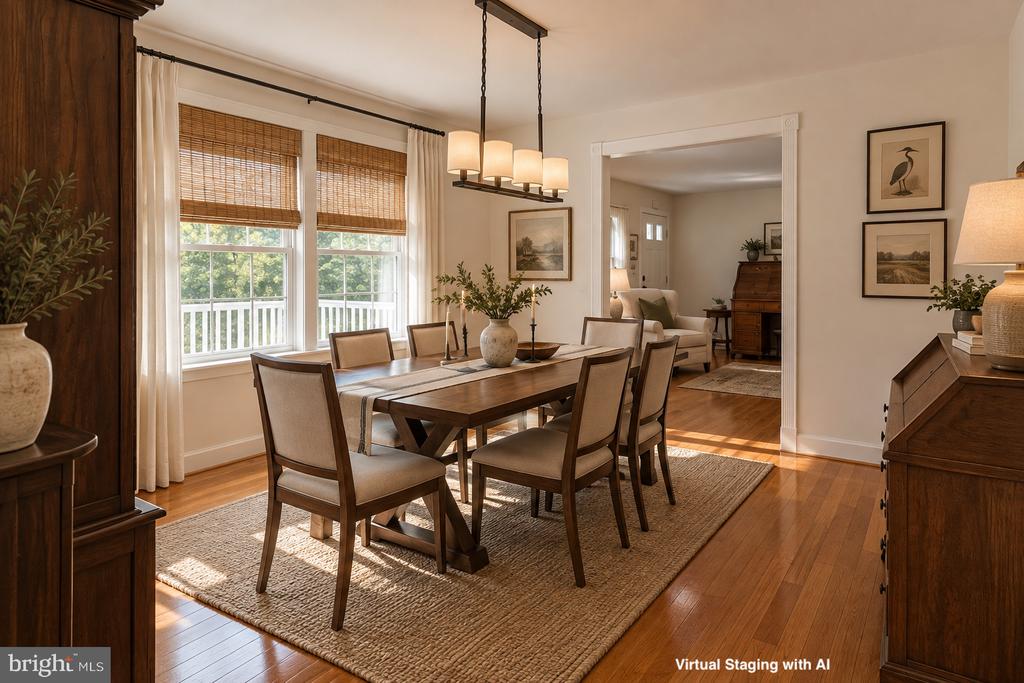Virtually staged dining room with a wooden table, woven rug, and two large windows.