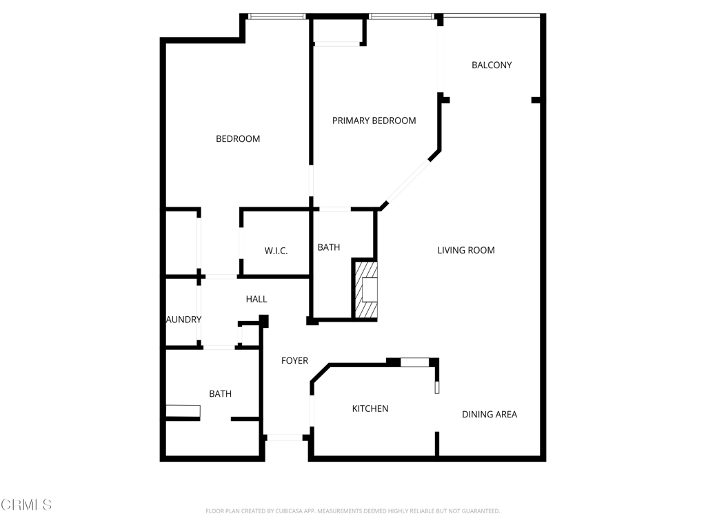 Floor plan showing two bedrooms, two bathrooms, a balcony, and the unit’s living, dining, and kitchen areas.