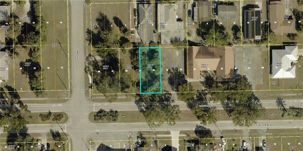 Vacant parcel outlined in cyan along Lincoln Boulevard, shown from above with neighboring homes and roads.