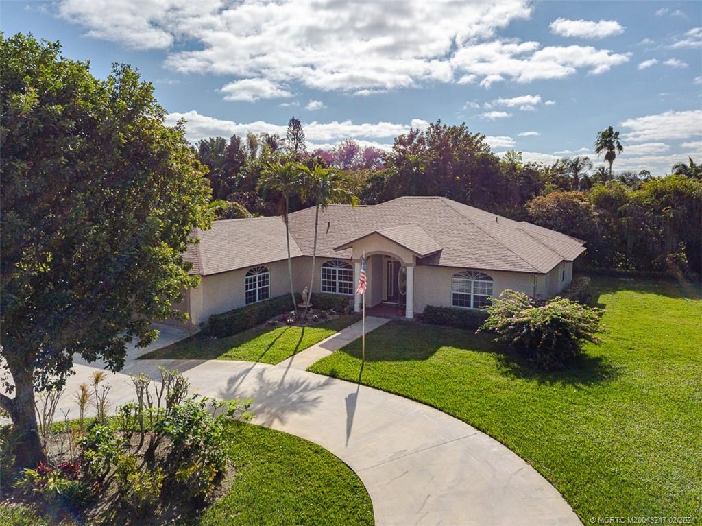 2440 NE Pinecrest Lakes Blvd