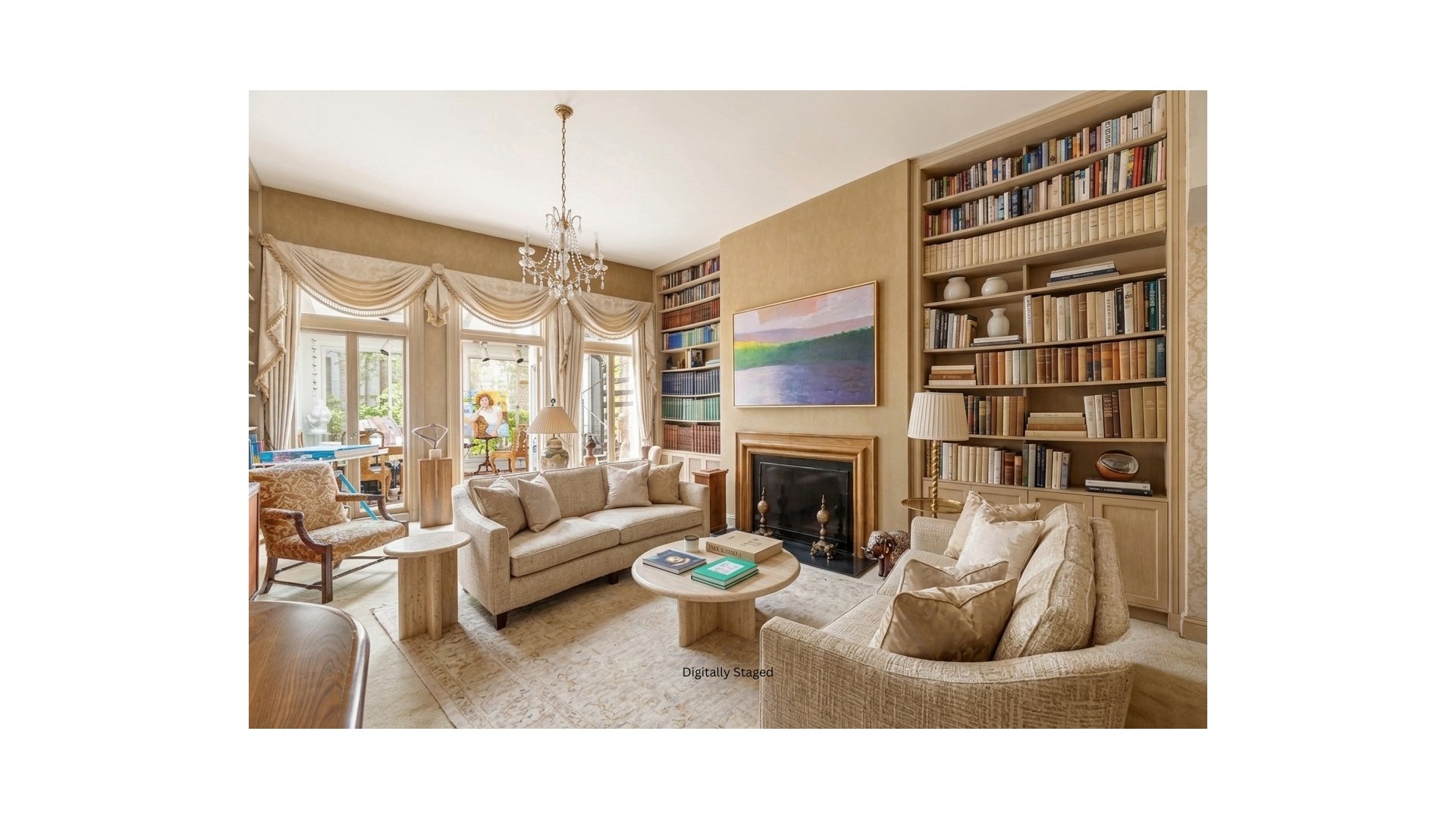 Living room with built-in bookcases, a fireplace, cream sofas, and large curtained windows.