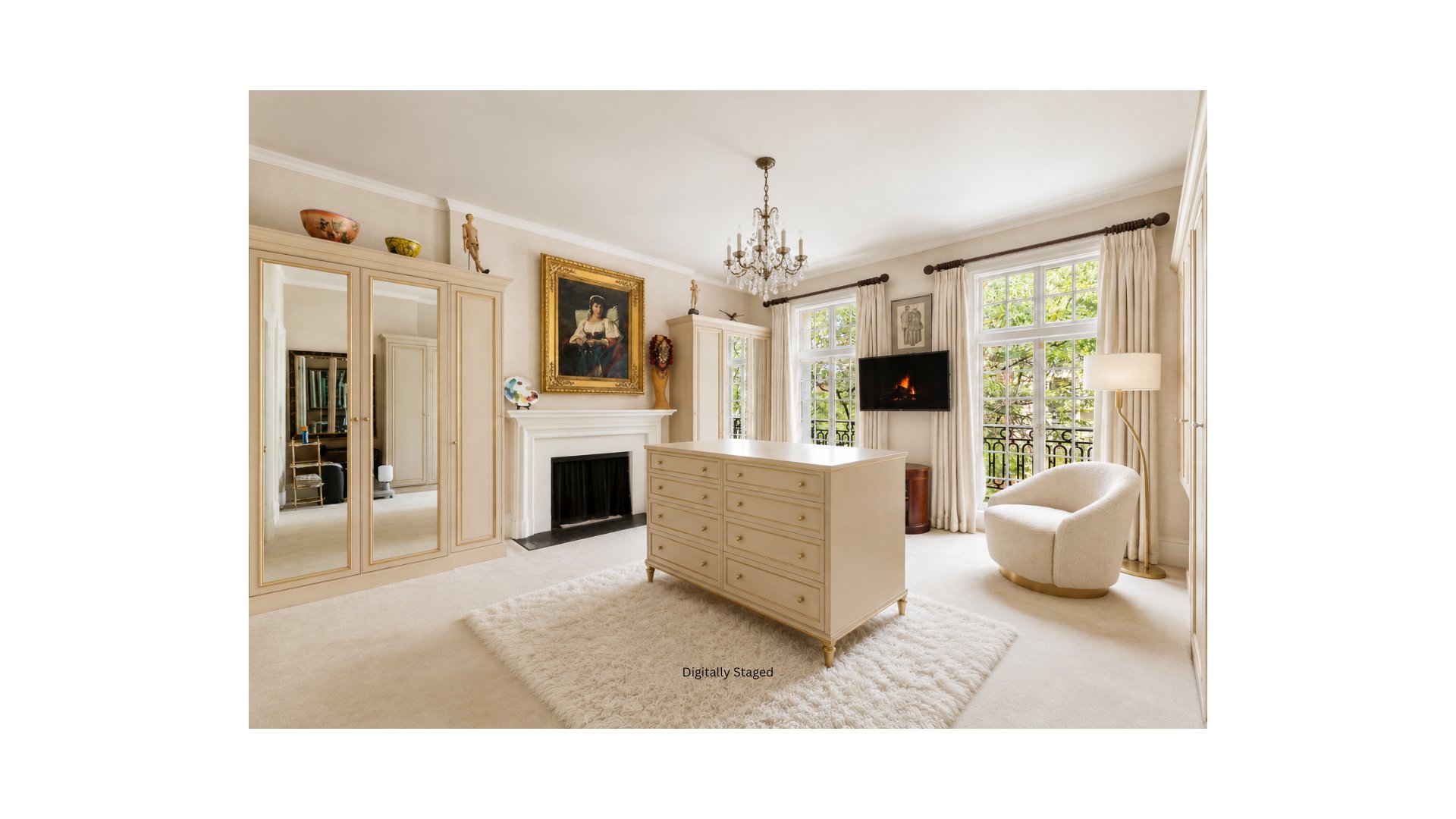 Bedroom with mirrored wardrobes, a fireplace, chandelier, and dresser beside tall garden-facing windows.