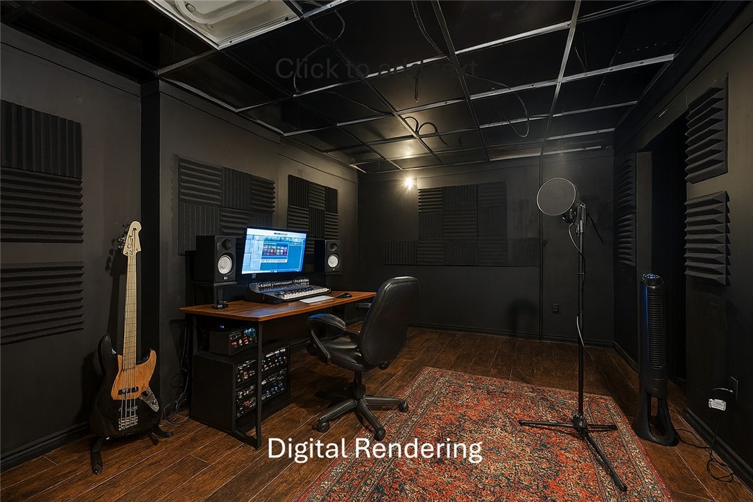 Recording studio with acoustic panels, mixing desk, bass guitar, and microphone stand.