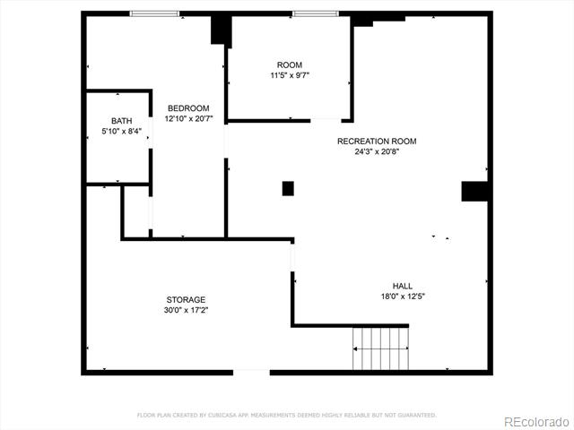 Floor plan with a large recreation room, bedroom, bathroom, storage area, and hall.