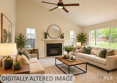 Staged living room with a fireplace, cream sofas, wood coffee table, and large windows.