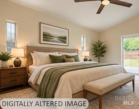 Furnished bedroom with a large neutral bed, green throw, foot bench, ceiling fan, and glass door to the yard.
