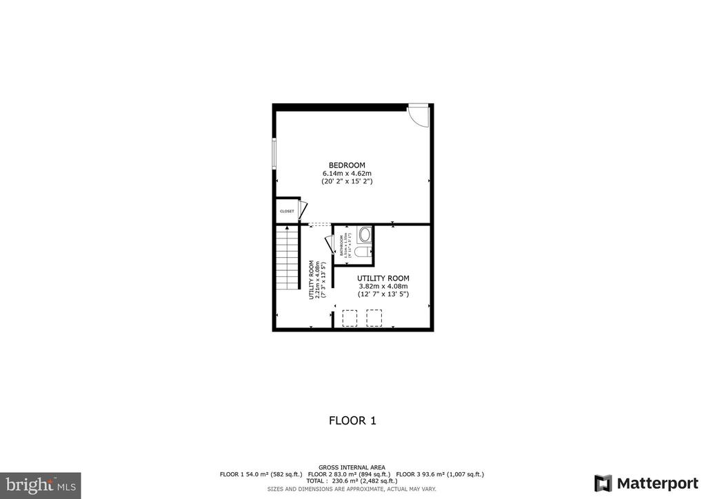 First-floor plan showing a bedroom, closet, bathroom, utility room, and staircase.