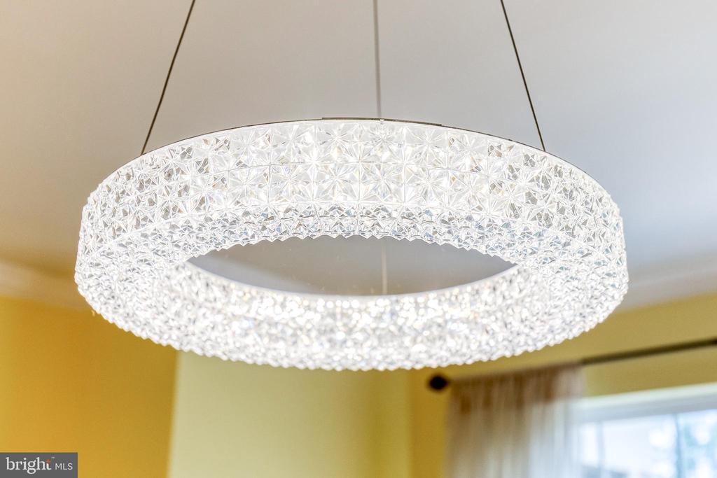 Circular crystal pendant light hanging from the ceiling.