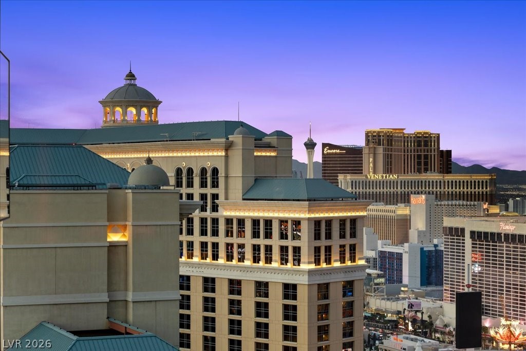 Las Vegas Strip skyline at dusk, including the Venetian, Palazzo, and Encore resorts.
