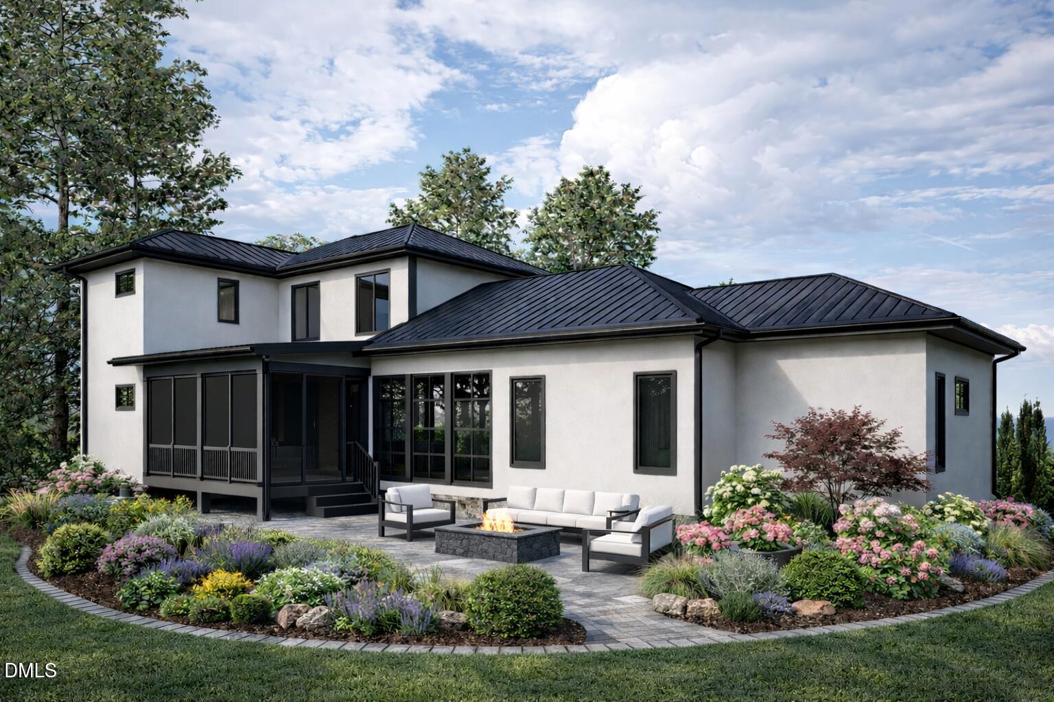 Modern white home with a black metal roof, landscaped garden, and patio fire pit.