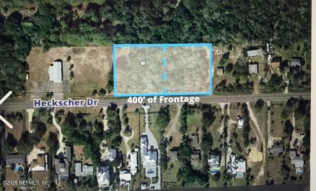 Aerial view of a highlighted vacant parcel along Heckscher Drive with 400 feet of frontage.