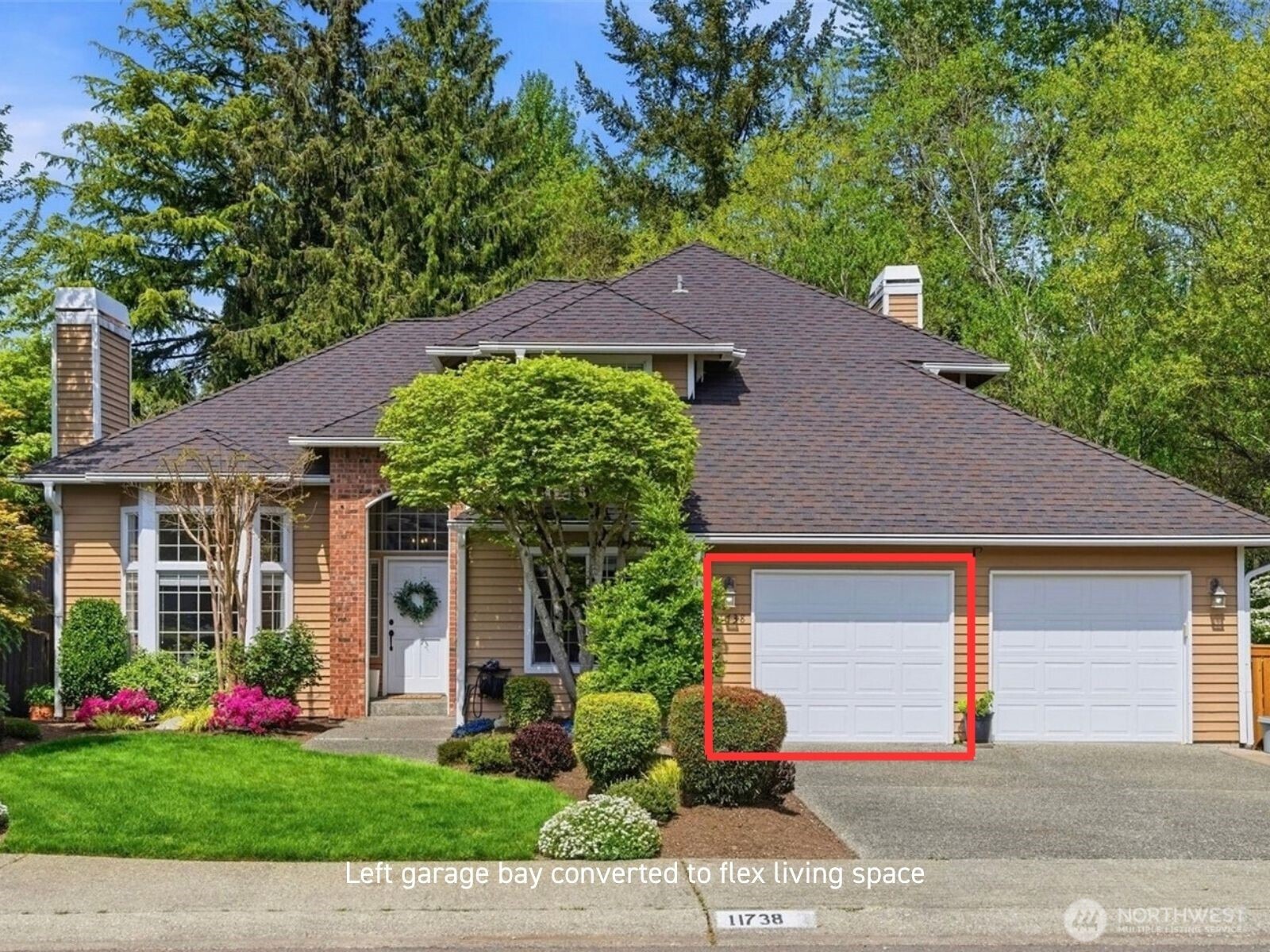 House front with the left garage bay outlined in red and labeled as converted to flex living space.