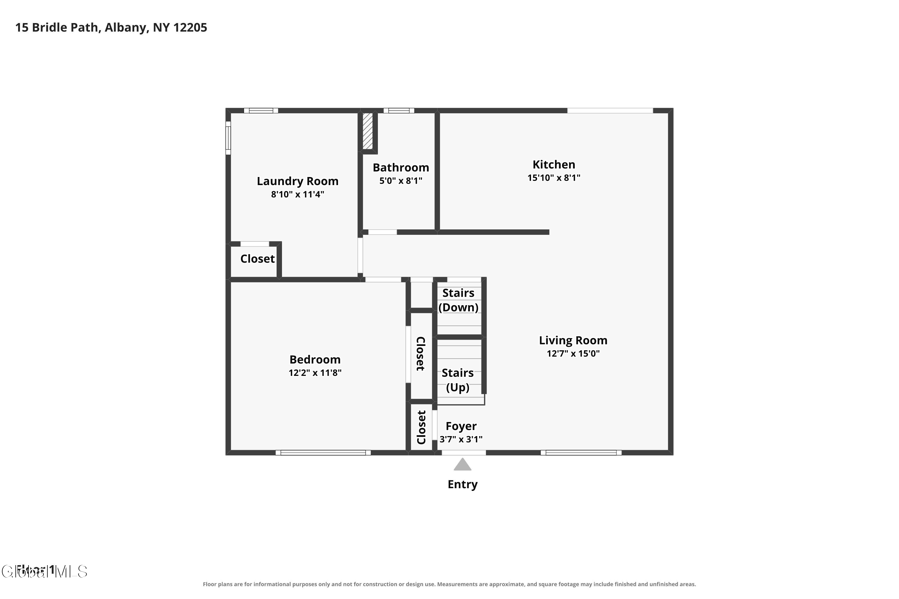 Floor plan showing a bedroom, living room, kitchen, bathroom, laundry room, foyer, closets, and stairs.