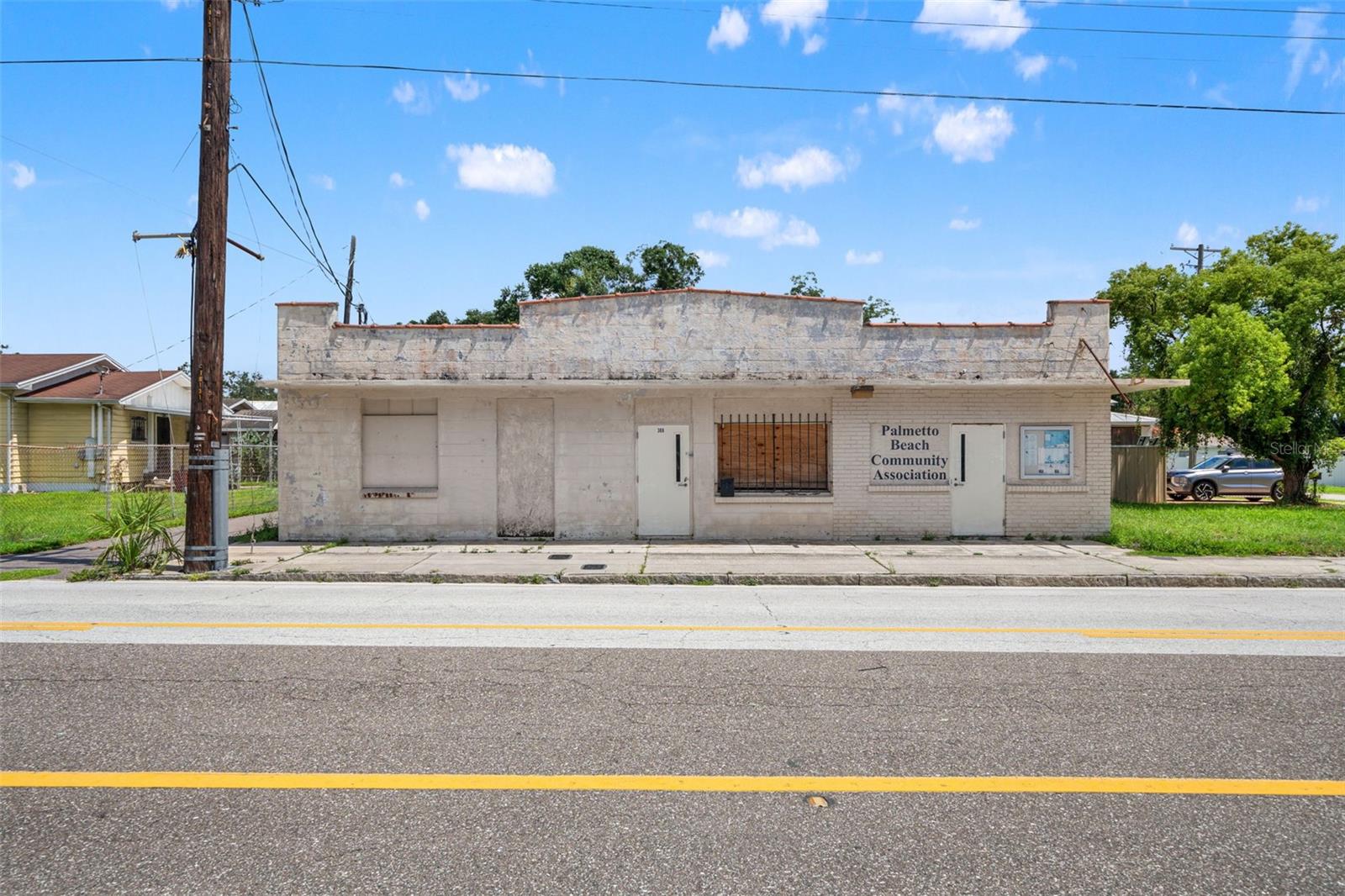 Palmetto Beach Community Association building with a weathered facade and barred windows.