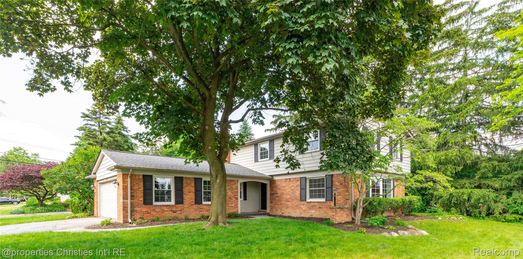 Front exterior in the 4-bedroom Colonial home for sale at 4770 Hedgewood Drive, Bloomfield Hills City, MI, listed by SK Group