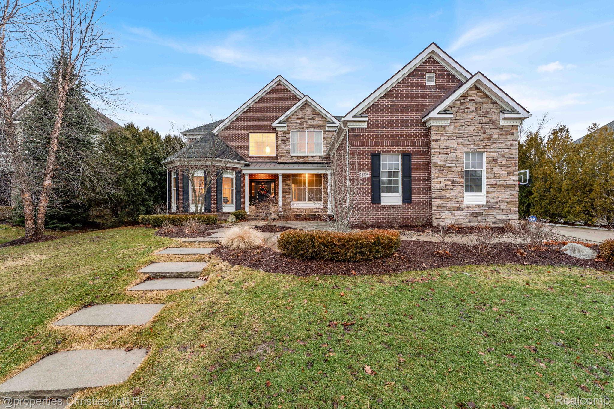 Front exterior 5-bedroom Colonial home for sale at 24329 Saybrook Court, Novi City,MI, listed by SK Group