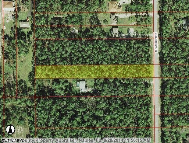 A wooded parcel highlighted among surrounding lots beside Cedar Blvd.